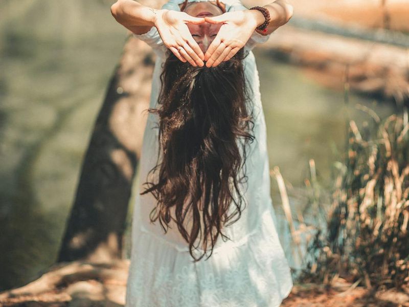A person meditating in a spacious, serene environment.