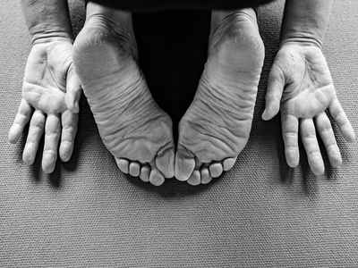 Close-up of feet on a yoga mat.